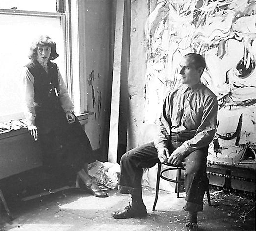 de Kooning in his studio with Elaine de Kooning, c. 1949.
